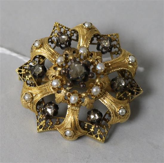 A late 19th/early 20th century yellow metal, split pearl and rose cut diamond set brooch, 35mm.